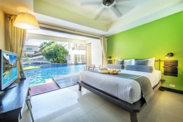 Resort med grønne soveværelsesvægge og swimmingpool i Chada Lanta
